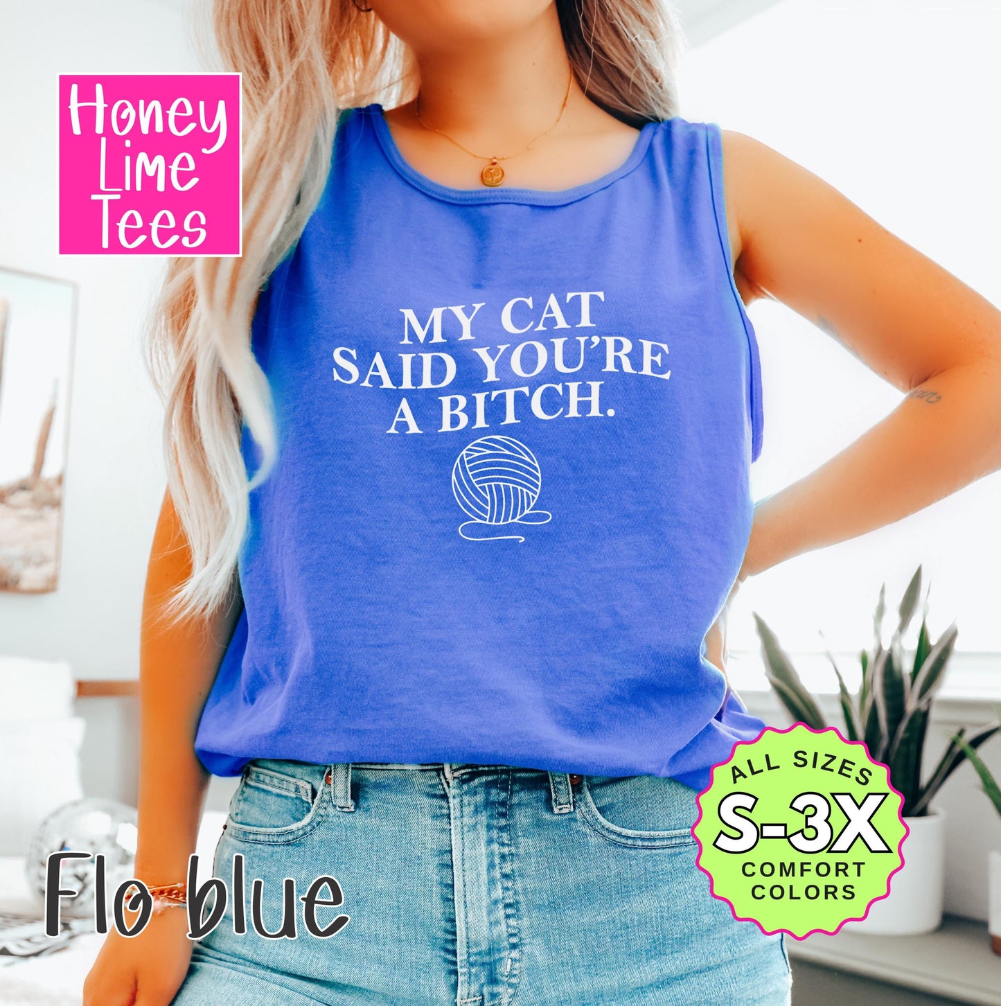 a woman wearing a tank top that says, my cat said you're a