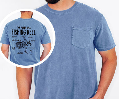 May include: A blue short-sleeved t-shirt with a pocket on the chest. The back of the shirt features a diagram of a fishing reel with labels. The text reads "THE PARTS OF A FISHING REEL".