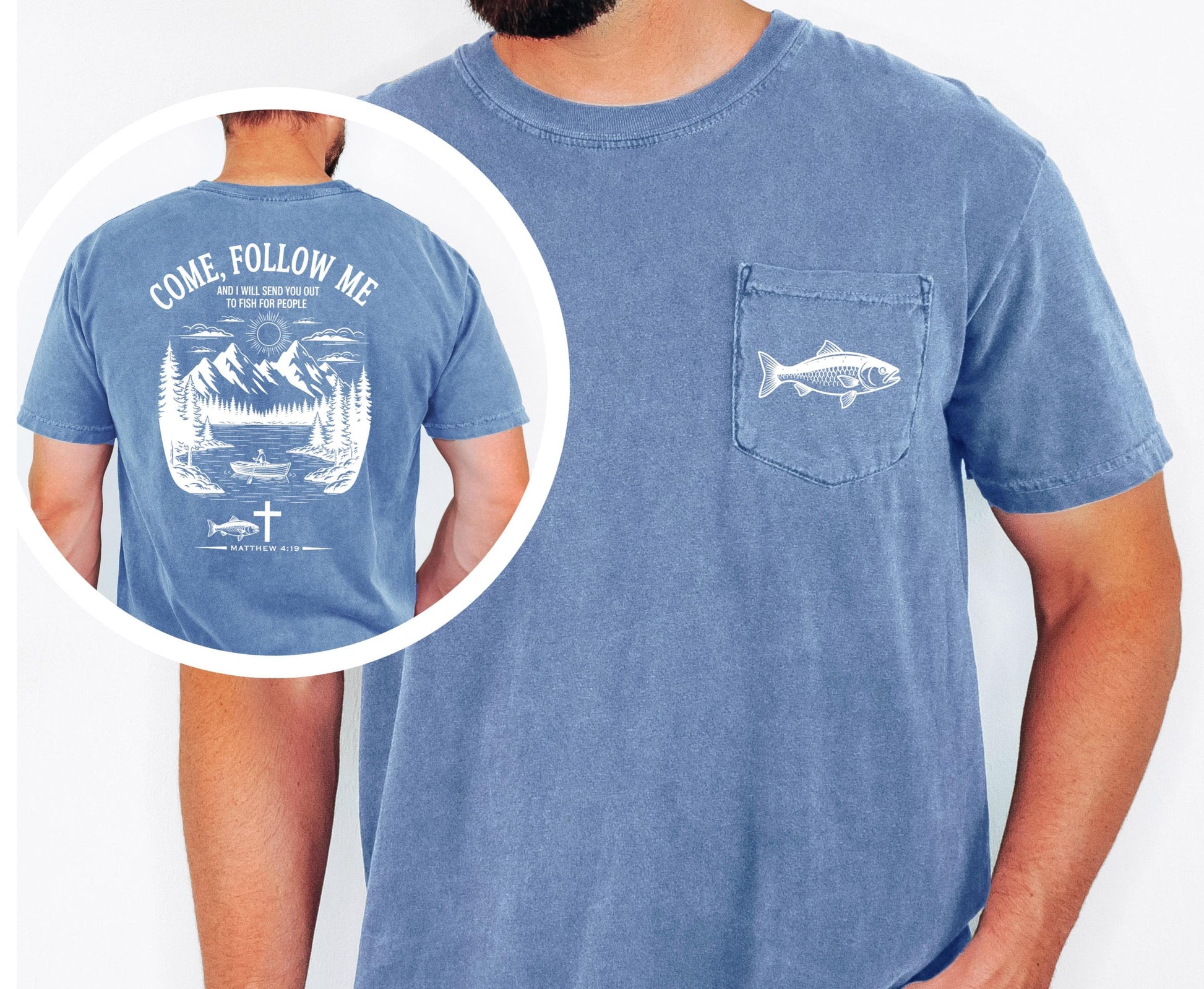 May include: A blue short-sleeved t-shirt with a pocket featuring a white fish graphic. The back of the shirt displays a white graphic with the text "COME, FOLLOW ME" and a mountain and lake scene with a boat, fish, and cross.