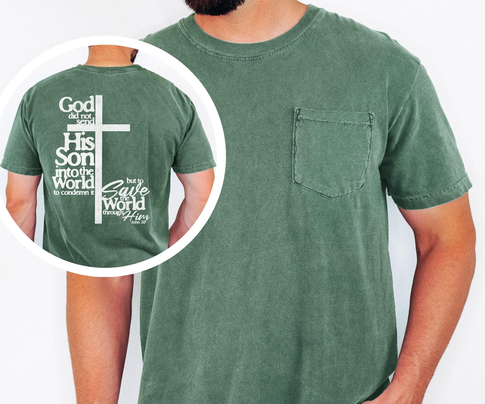 May include: A green t-shirt with a pocket on the chest. The back of the shirt features a white cross and text that reads "God did not send His Son into the world to condemn it but to save the world through Him."