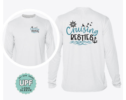 A white long-sleeved shirt with a design featuring a ship's wheel, anchor, and waves, along with the text "Cruising Besties" printed on the back.