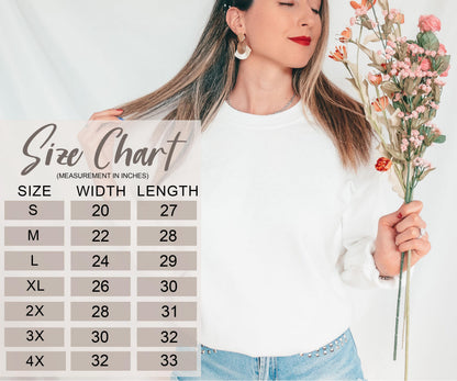 A woman holding a bouquet of flowers and wearing a white sweater, with a size chart displayed next to her.