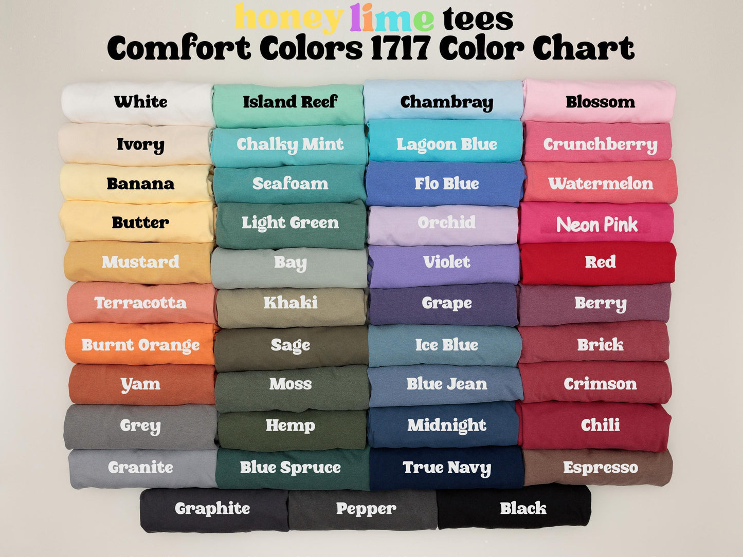 a bunch of different colored shirts hanging on a wall