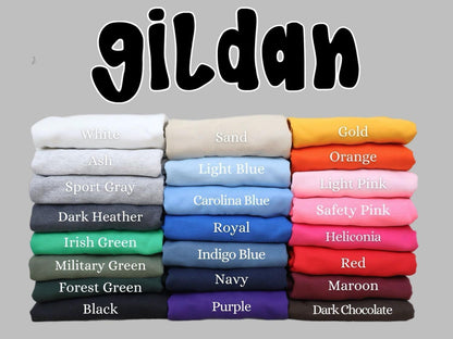A collection of various colored t-shirts stacked on top of each other, with the word "giltan" written above them.