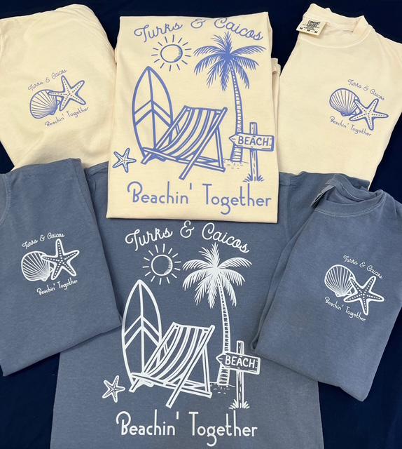 a collection of t-shirts and shirts featuring beach-themed designs, including palm trees, starfish, and beach chairs.